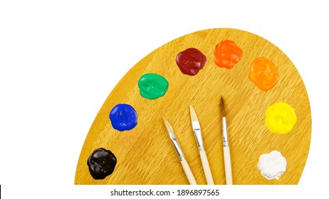 Art palette with paints and brushes isolated on white background. Artist's set