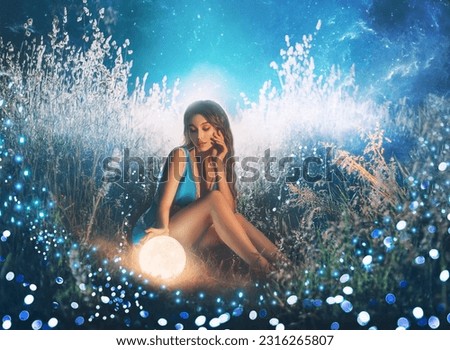 Art photo Fantasy woman touching moon with hand, glowing ball planet. night nature dark forest. Mystic moon light magic universe outer space. Fairy flying bright sparkle stars white fog blue grass.
