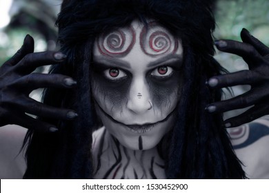 Art Photo Of A Mystic Faun With Spiral Patterns On His Forehead And Red Eyes