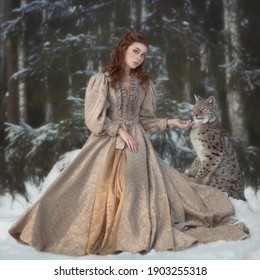 Art photo red-haired woman and forest lynx