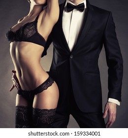 Art Photo Of A Young Couple In Sensual Lingerie And A Tuxedo