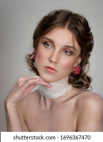 Art Photo Of A Young Girl With A White Bandage On Her Neck