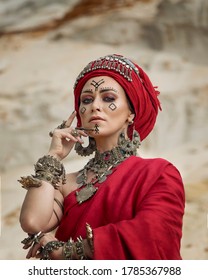 Art portrait of a Berber woman in a red turban