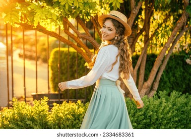 Art portrait happy woman dancing spinning in vintage straw hat on head, girl pretty smiling face red hair fly in wind, retro lady old style white blouse mint skirt. green tree sun light summer nature - Powered by Shutterstock