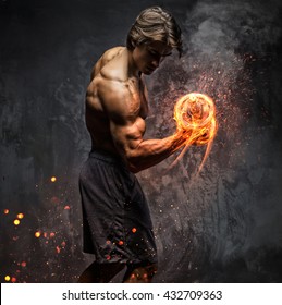 Art Portrait Of A Man With Burning Dumbbell.