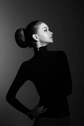 Art Portrait Woman In Black Turtleneck. Hair High Beam, Perfect Profile Face. Elegant Beauty Style. Earrings In The Ears