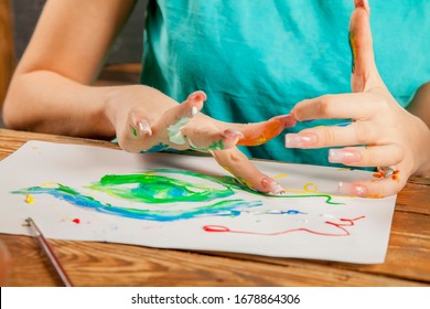 Art As Psychological Therapy For Mental Health. Young Beautiful Woman Painting With Fingers.  Inspiration And Creativity Concept. Selective Focus.