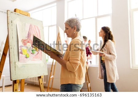 Similar – Image, Stock Photo Elderly woman painting in her art studio