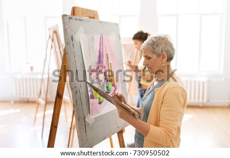 Similar – Image, Stock Photo Elderly woman painting in her art studio