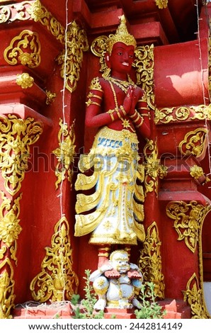 Art sculpture deity statue or carving angel figure lanna style of Wat Ming Mueang temple for thai people traveler visit respect praying blessing wish mystical at Chiangrai city in Chiang Rai, Thailand