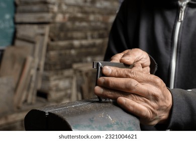 Art of Shaping: Blacksmith Hand-filing Excess Metal in Welded Wo - Powered by Shutterstock