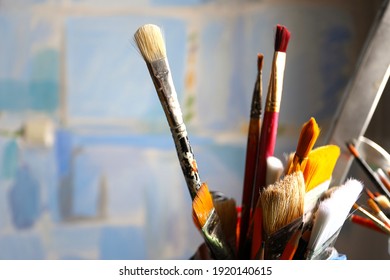 Art studio class painting brushes close up on blue abstract background. Brushes. Artist's workshop, artist's tools. Specially blurred. - Powered by Shutterstock