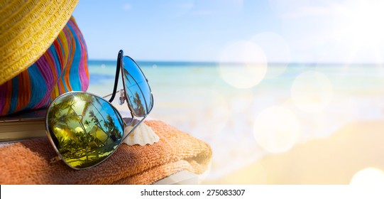 art summer Beach. Beach  scene with blank book - Powered by Shutterstock