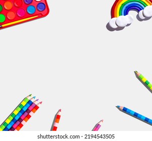 Art supplies and rainbow    overhead view    flat lay