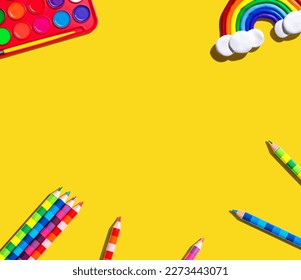 Art supplies and rainbow    overhead view    flat lay
