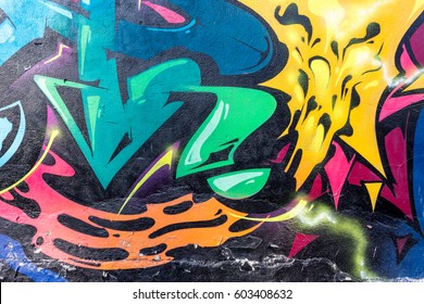 Art Under Ground. Beautiful Street Art Graffiti Style. The Wall Is Decorated With Abstract Drawings House Paint. Modern Iconic Urban Culture Of Street Youth. Abstract Stylish Picture On Wall