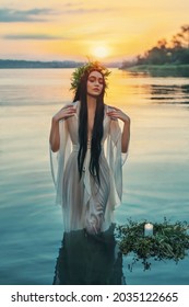 Art Virgo Zodiac. Pagan Girl Slavic Goddess Emerges From Water Lake, Ritual Flower Wreaths Candle Float. Fashion Model Fantasy Woman Witch Enjoy Summer Sunset. Wet White Vintage Medieval Nymph Dress