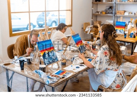 Art and Wine Celebration: Friends Painting and Toasting
