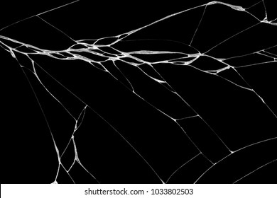 Art of wrinkles and cracks of glass caused by smashing and falling bumps. isolated on black background, This crack can be used as a pattern of floor tiles, in one corner also means loss and discord