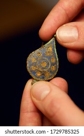 Artefacts Being Examined By An Archaeology Student