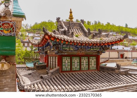 Artfully constructed roof of a pagoda on a temple in Kumbum Tibetan monastery near Xining, China, Asia