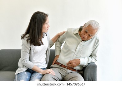 Arthritis joint pain problem in old man, Elderly asian man with hand on hip gesture, Daughter frighten and worry about her father injury symptom, Senior healthcare insurance concept.