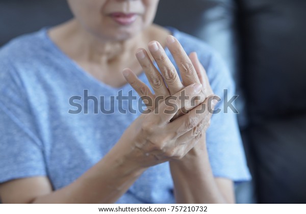 arthritis old person and Elderly woman female\
suffering from pain at\
home