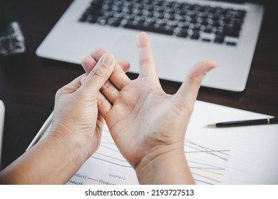 Arthritis person, finger woman ache from working in office. Concept office syndrome hand pain from occupational disease, woman having wrist pain from using laptop computer, wrist pain. - Shutterstock ID 2193727513