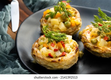 Artichoke dish with peas on black  - Shutterstock ID 2141392513