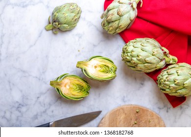 Artichokes and dishcloth on a light background