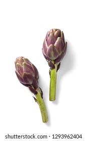 Artichokes isolated on a white background viewed from above. Top view. Copy space.