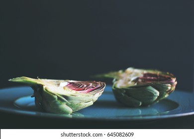 Artichokes With Wooden Background In Dark Food Photography Style