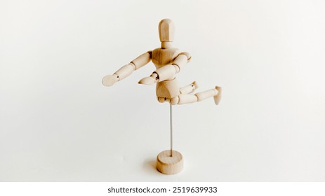 Articulated Wooden Mannequin Action Figure Flying Pose on White Background - Powered by Shutterstock