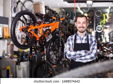 Artificer is working on master bicycle assembly in sports workshop.  - Powered by Shutterstock