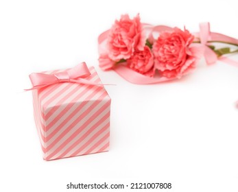 Artificial carnation flowers and gift boxes - Powered by Shutterstock