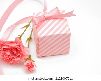 Artificial carnation flowers and gift boxes - Powered by Shutterstock