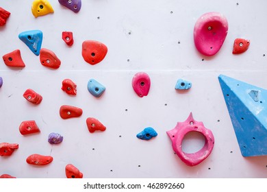 Artificial climbing wall in an indoor climbing gym - Powered by Shutterstock