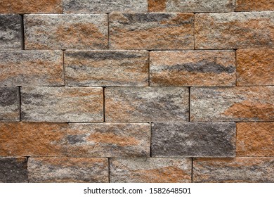 Artificial decorative stone on the building. Backgrounds and textures