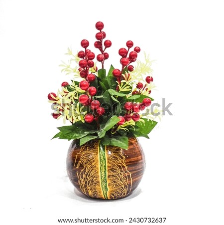 artificial flower pot isolated on white background, Artificial flowers in small pot on wooden table with empty space for background. wood pot Holly Plant
