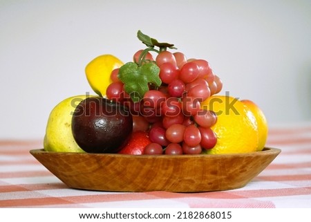 Artificial fruit tray on a table