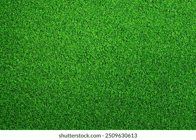 Artificial grass, covering. Artificial green grass mat, top view. Texture. Background. Artificial turf, surface made of synthetic fibers. Flat green grass texture background. Short grass