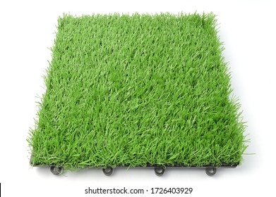 Artificial Grass Flooring, Building Decoration Materials, Indoor Stadium Or Football Fields, Playgrounds, Landscaping. Example Of Artificial Grass Isolated On White Background.