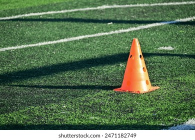 artificial green grass soccer field with orange training cones - Powered by Shutterstock