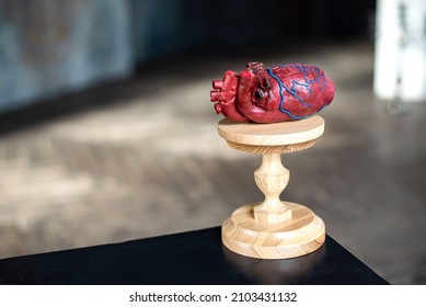 artificial human heart on a pedestal