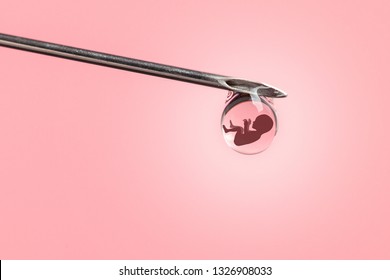 Artificial Insemination. Test Tube Baby, IVF. On The Tip Of The Needle Drop Of Syringe With The Silhouette Of Baby Embryo