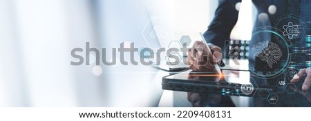 Artificial intelligence (AI), machine learning, data mining, digital technology concept. Businessman using digital tablet with Ai and big data management. Business Intelligence, technology background