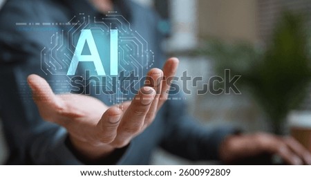 Artificial intelligence analysis algorithm technology. Ai analyst machine learning. Artificial intelligence. A person is holding up their hand to a computer screen that displays the word AI.
