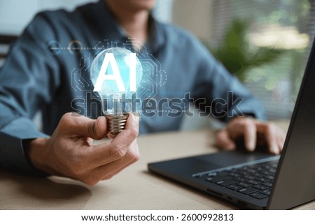 Artificial intelligence analysis algorithm technology. Ai analyst machine learning. Artificial intelligence. A person is holding a light bulb and the word A1 is displayed on a laptop.