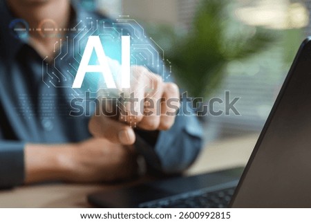 Artificial intelligence analysis algorithm technology. Ai analyst machine learning. Artificial intelligence. A person is pointing at a computer screen with the word AI on it.