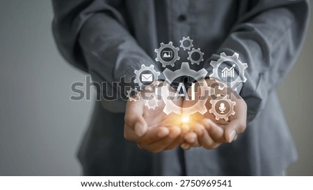 Artificial intelligence automation concept with AI gear icons and digital technology symbols above hands, representing smart automation, machine learning, business technology innovation and AI solutions.